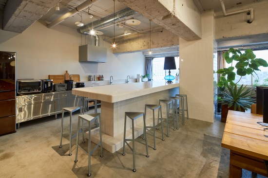 View of the kitchen counter covered in white tiles
