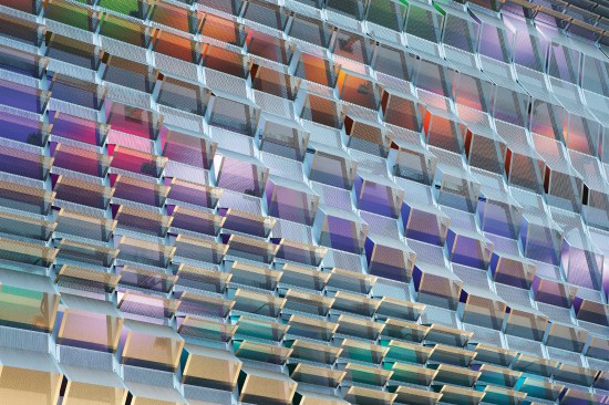 Color-changing LED floodlights illuminate the Center Street parking structure beyond, while the scrim is front-lit with white LEDs.