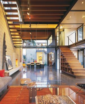 By separating the project into a main house (left) and garage/guest house (this page, rear) Ehrlich created an outdoor room that acts as an extension of both spaces.