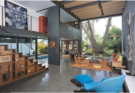 Existing trees, new landscaping, and a perimeter wall all enhance this urban home’s sense of privacy.