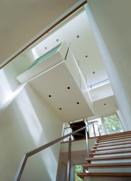 Custom Home, November/December 2009 Last Detail: Higher Ground  Architect: David Jameson, Washington, D.C.; Builder: Added Dimensions, Washington, D.C.  This suspended meditation chamber forms the physical and spiritual core of a Bethesda, Md., residence. The 8-foot-by-11-foot pod hangs from a series of exposed steel rods and receives added support from the shear wall beneath. Enclosed in translucent glass and plaster and bathed in daylight from nearby clerestory windows, the refuge casts a gentle glow into the center of the home.