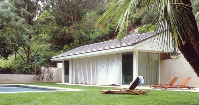Custom Home Outdoors – Winter 2005  “Open House” from Pool Houses case study   Architect: Montalba Architects, Santa Monica, Calif.; Builder: Sarlan Builders, Santa Monica  This 680-square-foot pavilion features disappearing glass walls on three sides. A 42-foot cambered steel beam gives the gabled roof enough support so that concrete roof tiles don't put pressure on the sliding glass. Architect David Montalba strengthened the bond between pavilion and pool by making them the same size and shape.