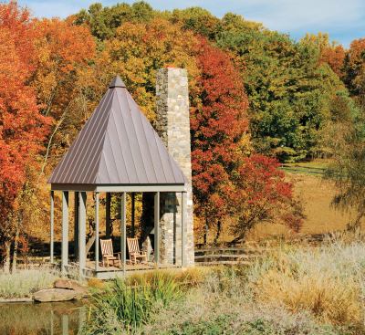 CHDA 2006 –Accessory Building / Grand Award Architect: Robert M. Gurney, FAIA, Architect, Alexandria, Va.; Builder: SugarOak, Herndon, Va.   A diminutive 196 square feet in plan, this simple pavilion makes a big statement about the power of architecture to enhance an already special environment. The pavilion seems to float above the landscape, its light steel frame contrasting with a massive stone chimney that suggests the remnant of a long-lost building. A steep hip roof gives the tiny building a significant presence in the landscape.