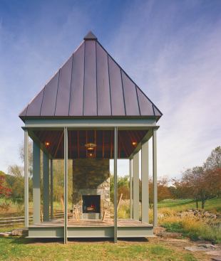 CHDA 2006 –Accessory Building / Grand Award  Architect: Robert M. Gurney, FAIA, Architect, Alexandria, Va.; Builder: SugarOak, Herndon, Va.   A diminutive 196 square feet in plan, this simple pavilion makes a big statement about the power of architecture to enhance an already special environment. The pavilion seems to float above the landscape, its light steel frame contrasting with a massive stone chimney that suggests the remnant of a long-lost building. A steep hip roof gives the tiny building a significant presence in the landscape.