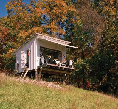 Architect Jeffery Broadhurst designed and built this modest retreat with framing and a corrugated metal roof visible both inside and out. He also optimized the off-the-grid structure for cross-ventilation.