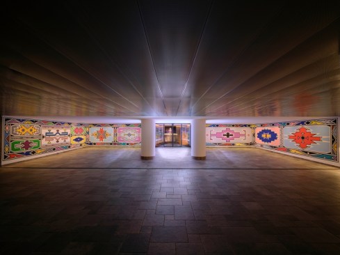 Caption: Carport for the private residence featuring large-scale murals by Esther Mahlangu and Babylon Micro Farm (just visible).