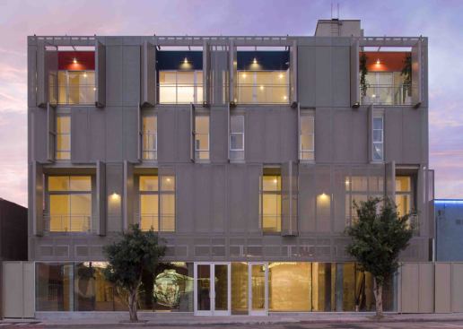 Bi-fold sections allow residents to open up the metal screening system for additional light, ventilation, and views as desired. The random openings lend the building a unique look, adding to its edgy feel.