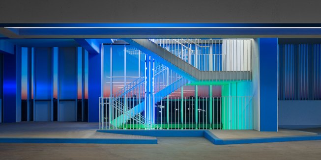 Car Park Four, Chesapeake Energy Corporation, Oklahoma City, 2015One of four stairways within the building. Colored light identifies the floor level beginning at the stair and continues into the parking level. The exterior glass provides a wind break.