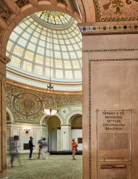 The Tiffany dome in the Chicago Cultural Center; wall text by the Settler Colonial City Project