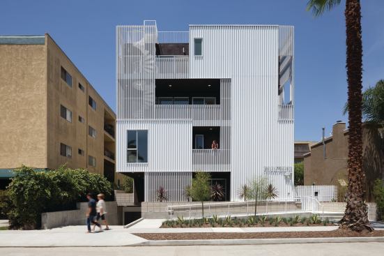 749 Cloverdale's layered façade conceals balconies that serve as exterior circulation for the complex.