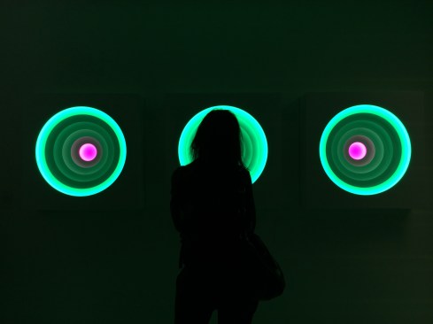 A visitor at Light+Building watching the Color Wheels installation.