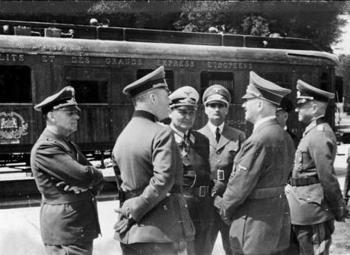 Nazi leaders and military commanders in front of Ferdinand Foch’s railroad dining car in Compiègne, France, on June 22, 1940. The car had been moved to the identical location where Germany had surrendered on Nov. 11, 1918. Among the group are Wilhelm Keitel (hand behind back), Hermann Göring, Rudolf Hess, and Hitler. After French officials signed the second armistice, the Germans transported the car and selected monuments to Berlin before razing the site.