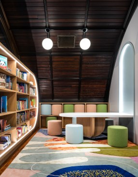 Library looking south to pouf seating storage and reading table