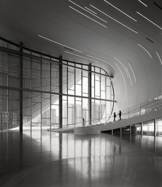 One+of+the+few+orthogonal+moments+in+the+center%2c+a+vertical+curtainwall+system%2c+hides+behind+an+exterior+surface+that+bows+to+touch+the+ground.+