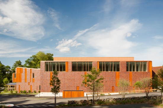 Light collecting gymnasium with interior baffles
