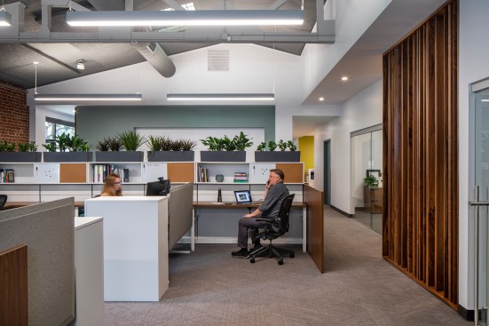 The public side can be closed off through a series of full height sliding doors, providing privacy and quiet for the staff offices when events are taking place.