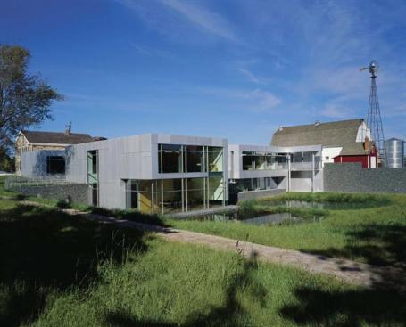 The historic farmstead retains its character, thanks to Valerio's decision to embed his addition a full level into the ground. The upper floor of two-story structure is level with ground floor of farmhouse (at left) and barn.