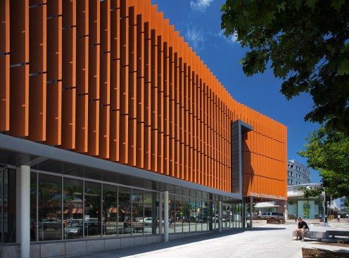 Perforated vertical fins allow for shading while reinforcing openness