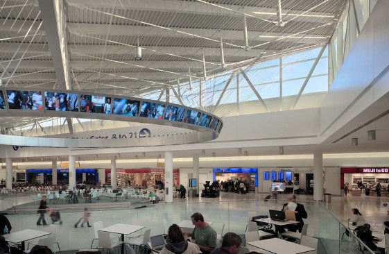 The Marketplace, located just past the security area, serves as the central concessions area. The three concourses branch off it. Restaurants and stores, a performance venue, and a suspended, egg-shaped ?information yoke? dominate the space.