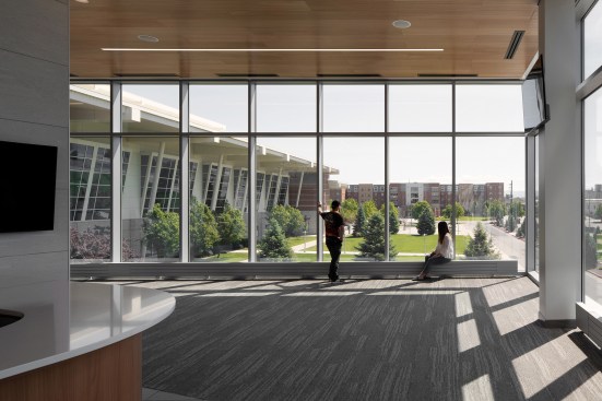 In addition to providing food service for student athletes, the banquet area is used for pre-functioning prior to games at adjacent McCarthey Athletic (seen through windows to the left).