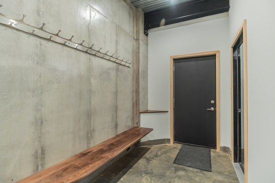Entryway with custom stainless steel coat rack, PA black walnut shoe bench