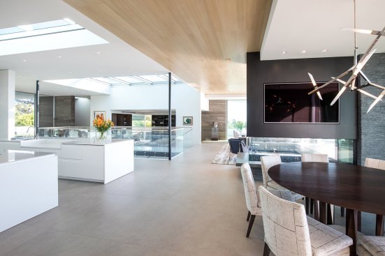 Open plan Beverly Hills modern home with natural light through skylights.