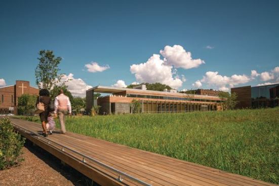 A+wooden+bridge+connects+the+historic+Weeksville+homes+to+the+new+structure.+
