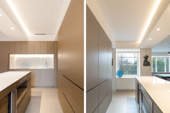 The island hides a wine fridge, microwave, and pull-out trash. Opposite the sink wall includes a dishwasher and 24" induction cooktop and wall oven. Recessed finger pulls are used throughout the apartment for a super clean, minimal look without any hardware.