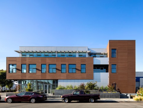 Layering of planters at plaza edge corresponding with layering of building form