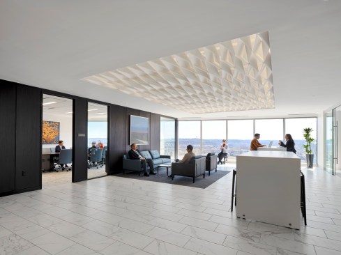 Floor to ceiling windows in the lobby reveal panoramic city and river views.