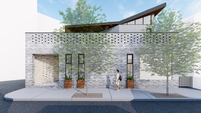 Currently under construction, the Triangle House in Chicago is an irregularly shaped addition that includes salvaged glass block and new brick perforations on the principal façade.