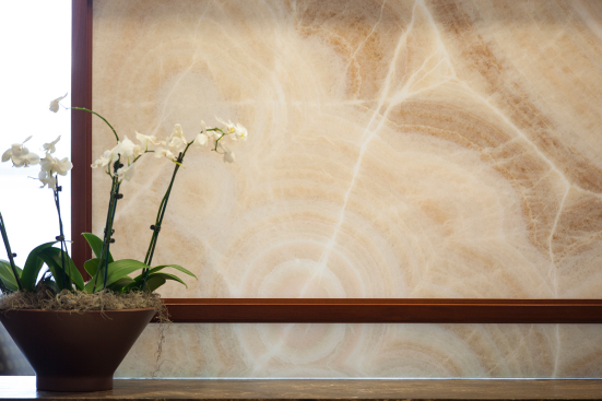 Partition in ViviStone Cream Onyx glass with Pearlex finish at Burr & Forman, Orlando, Florida