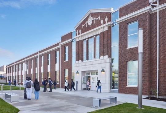 The north wall is adorned with salvaged historic terra cotta elements elevating the familiar community entrance.
