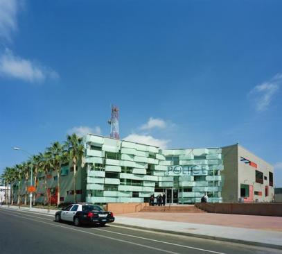 Large windows and bright colors dot the exterior of the building in contrast to the impermeable exterior of the old station. In front of the glass fa?ade, a community plaza provides a space for local events and for the officers to interact with area residents.