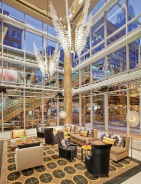 The hotel?s double-height lobby at the corner of State and Lake streets features floor-to-ceiling glazing, which encourages people on the adjacent elevated trains to look inside, making this an ideal location to see and be seen. Interiors by Beverly Hills, Calif.?based Cheryl Rowley Design depart from the hotel chain?s business-casual norm.