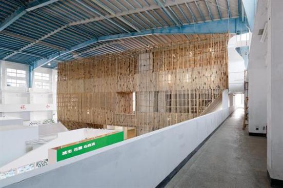 The rest of the hangar doesn't lie fallow: Temporary exhibition space fills the rest of the ground level, and can be overlooked by second level balconies.