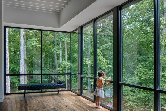 Tonic's clients wanted to maintain a direct visual connection with their beautiful wooded site. The abundant glazing fulfills that wish.