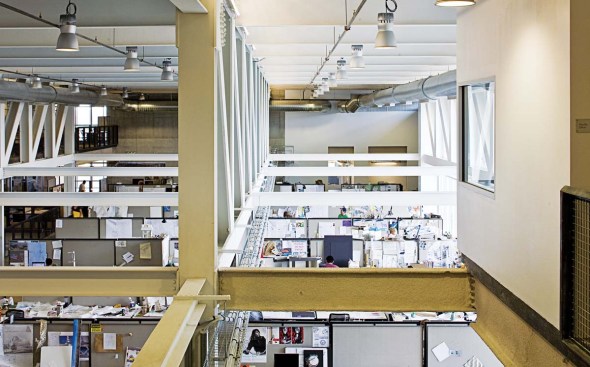 BUILDING AS LEARNING TOOL "The guts of the building are hanging out, in an instructional sense," says Predock, when describing the building's interior. All systems are exposed, from the massive steel trusses to cable trays that snake along the ceilings, bringing power and network operations to every workstation. The exterior walls--of poured-in-place concrete tinted an adobe tone to match the other campus buildings--are exceptionally thick. The thickness accommodates a plenum that creates airflow in an inductive-air system.