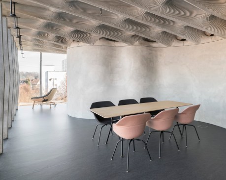 DFAB House's, in Dübendorf, Switzerland, by ETH Zurich "Smart Slab" fabrication technique allows for complex architectural design and structural geometries while optimizing stability.