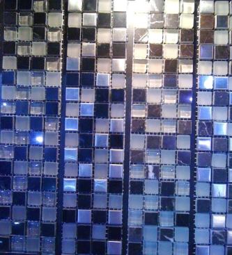 Diamond Tech Tiles  Glass mosaics are common, but these days manufacturers are mixing media. In this case, the company mixes marble, stainless steel, and glass in a single sheet. The product comes in 14 color combinations. 
www.dttiles.com.
