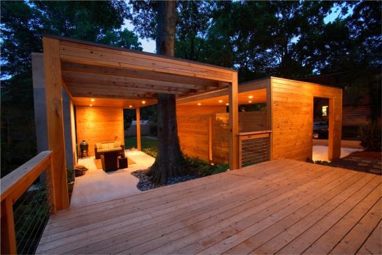 CHDA 2009 – Outdoor Spaces / Merit Award Architect: Lightroom LLC, Decatur, Ga.; Builder: Pinnacle Custom Builders, Decatur   Local materials and references to Southern vernacular building types inform the sculptural modernism of this cost-efficient backyard complex. The living pavilion's freestanding fireplace makes reference to the chimneys of burned-out country houses that dot the Georgia countryside. Nature intervenes in the form of a stately water oak that anchors a corner of the living area, rising through a roof that dissolves into an open trellis.