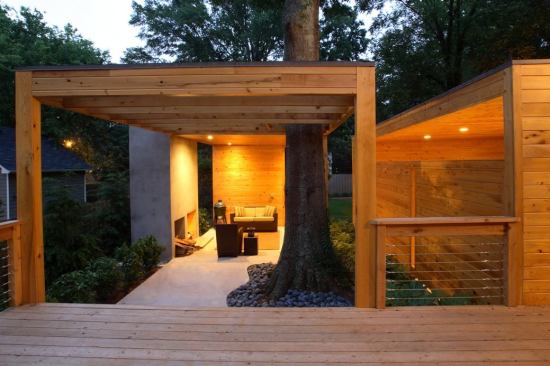 CHDA 2009 – Outdoor Spaces / Merit Award  Architect: Lightroom LLC, Decatur, Ga.; Builder: Pinnacle Custom Builders, Decatur   Local materials and references to Southern vernacular building types inform the sculptural modernism of this cost-efficient backyard complex. The living pavilion's freestanding fireplace makes reference to the chimneys of burned-out country houses that dot the Georgia countryside. Nature intervenes in the form of a stately water oak that anchors a corner of the living area, rising through a roof that dissolves into an open trellis.