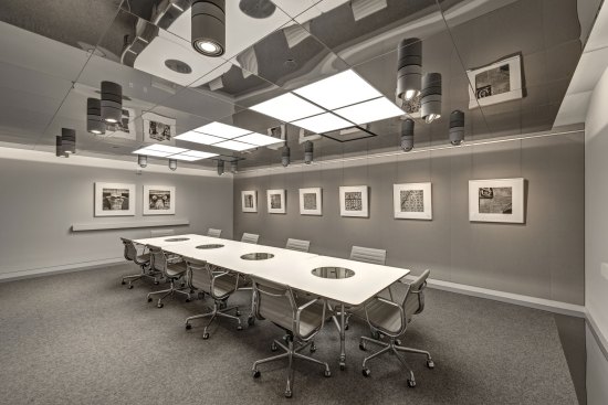 Primary conference with fabric-wrapped acoustical panel wall