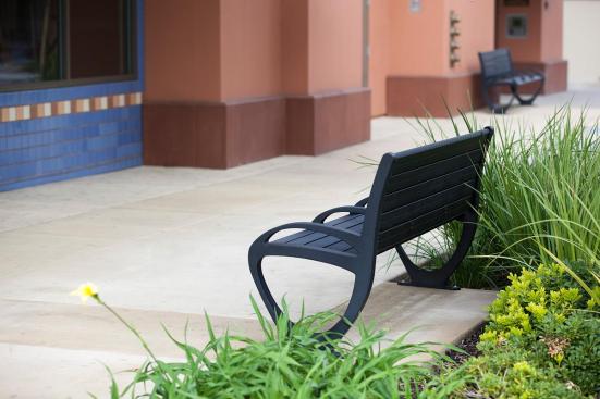 Trio Benches shown in 6 foot, backed configuration with Black Texture powdercoated frame, extruded aluminum slats and two armrests at BART, Pleasant Hill/Contra Costa Centre Station, Walnut Creek, California