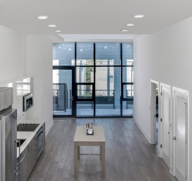 Units are fully integrated and efficient with extensive millwork and custom built-in features.