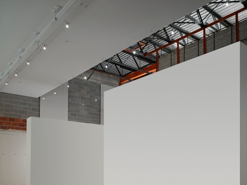 The+exposed+structure+of+the+1960s+addition+and+the+new+temporary+walls.