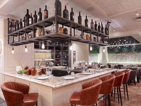 The decorative ceiling extends over the antipasto bar where the chef makes hand-cut pasta in full view of the public.  The Ceilume ceiling panels are washable, impervious, and meet health department requirements for use over food preparation areas.