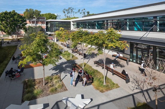 The lounge addition takes cues from solar shading on neighboring buildings.