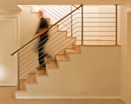 A lower level houses two guest bedrooms as well as a sitting room and abundant storage