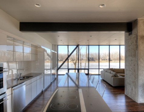 Interior view looking through the kitchen to the lake beyond